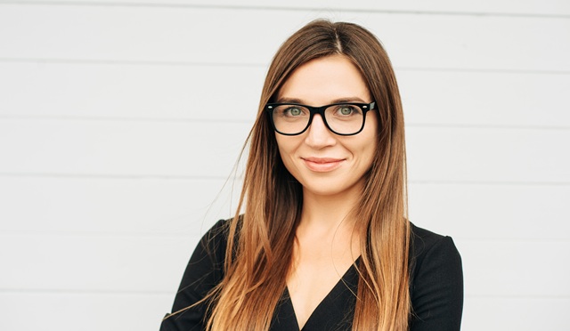 Close up portrait of beautiful young businesswoman wearing eyeglasses